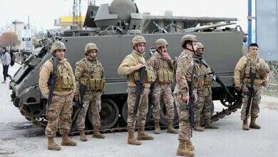 Members of the Lebanese army secure the area in Burj al-Muluk, near the southern Lebanese village of Kfar Kila